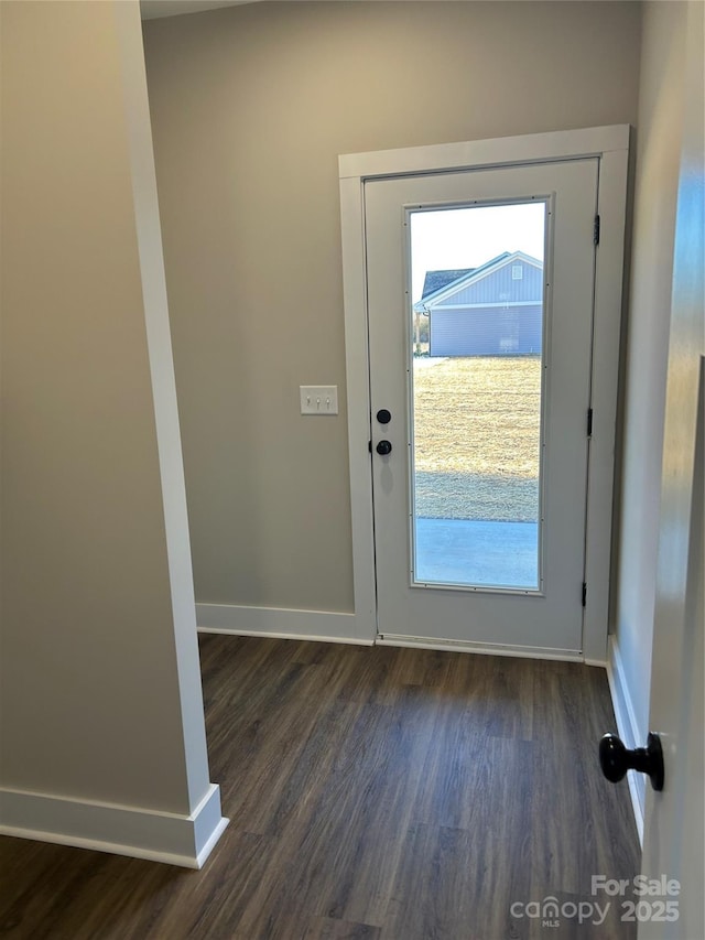 doorway to outside featuring dark hardwood / wood-style floors