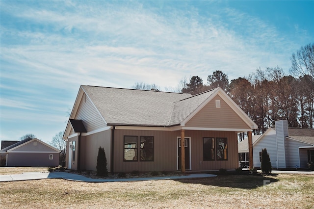 view of front of home with roof with shingles