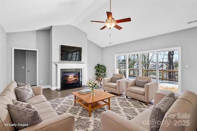 living room with hardwood / wood-style flooring, lofted ceiling, and ceiling fan