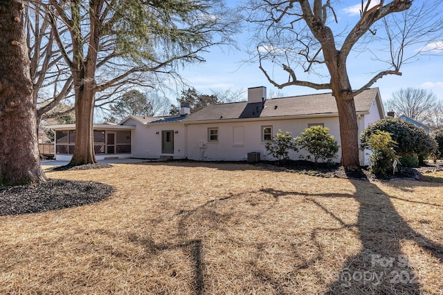 back of property featuring a sunroom and central air condition unit