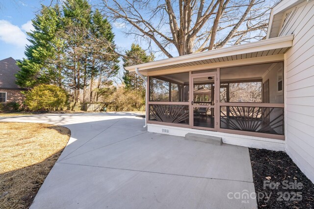 view of patio / terrace with a sunroom