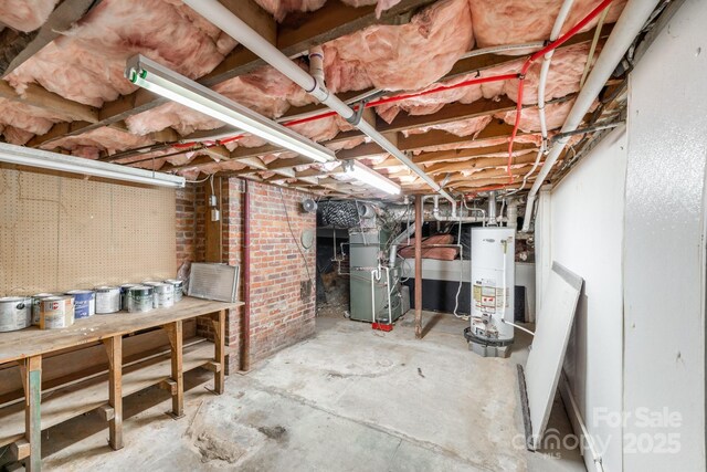 basement featuring heating unit and gas water heater