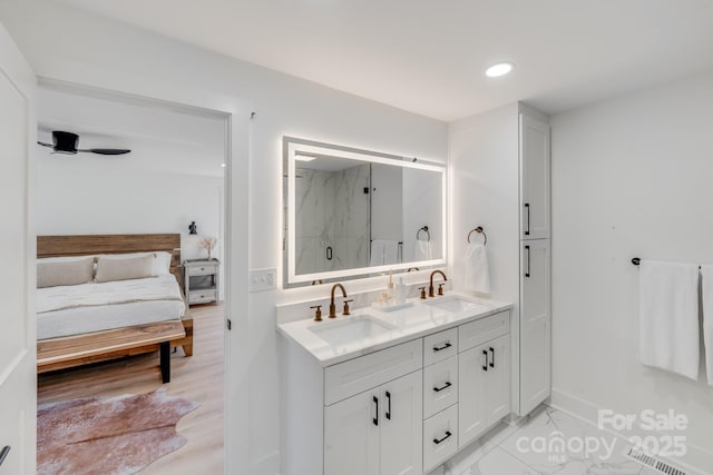 bathroom with vanity and walk in shower