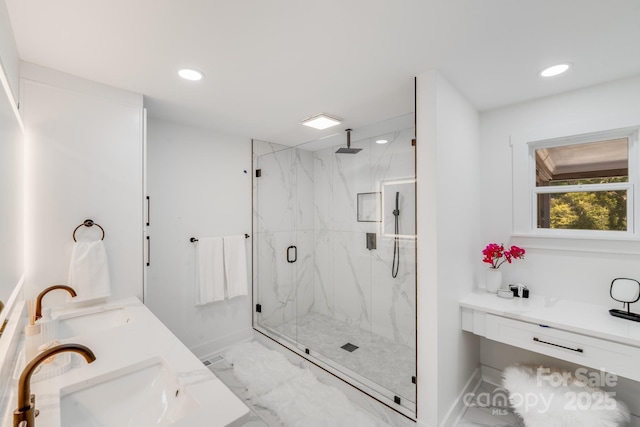 bathroom with an enclosed shower and vanity