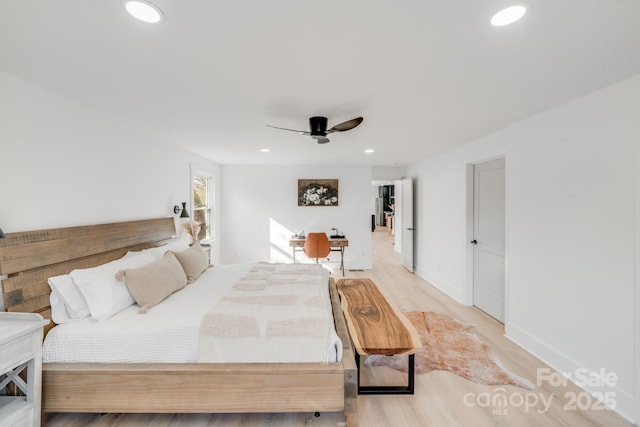 bedroom with light hardwood / wood-style flooring and ceiling fan