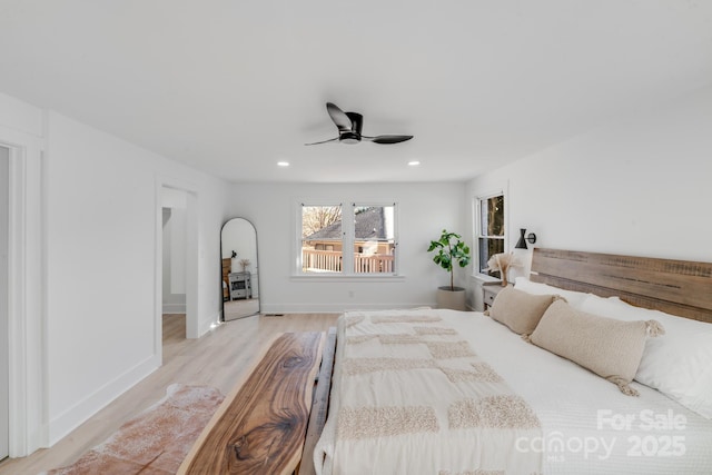 bedroom featuring light hardwood / wood-style floors and ceiling fan