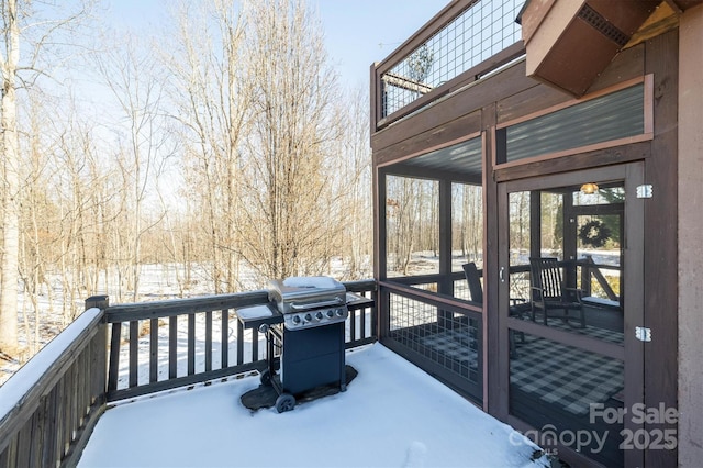 snow covered deck with grilling area