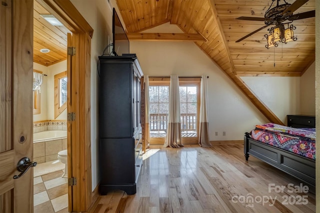 bedroom featuring connected bathroom, vaulted ceiling, light hardwood / wood-style floors, and wooden ceiling