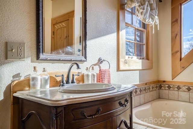 bathroom featuring a tub and vanity