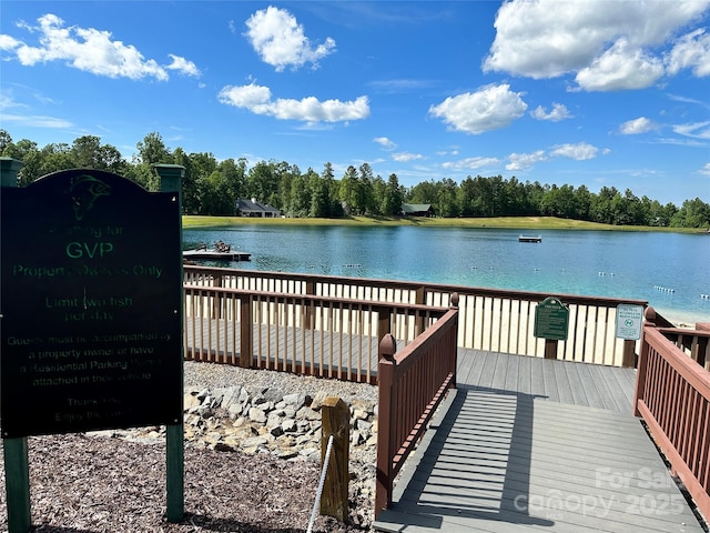 dock area with a deck with water view