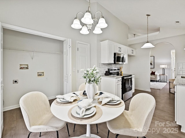 173 Brookshire Dr, Fort Mill, SC 29715 - dining room featuring high vaulted ceiling, dark hardwood / wood-style floors, and a notable chandelier