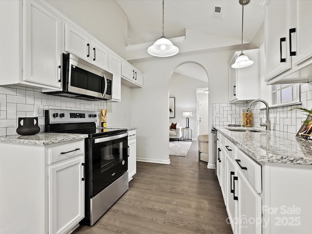 173 Brookshire Dr, Fort Mill, SC 29715 - kitchen featuring appliances with stainless steel finishes, sink, white cabinetry, and decorative light fixtures