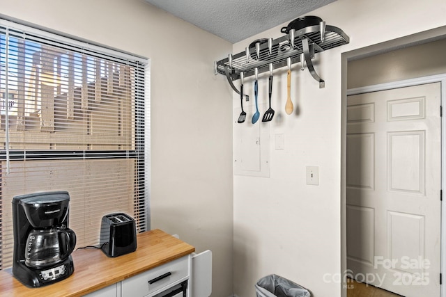 mudroom featuring a textured ceiling