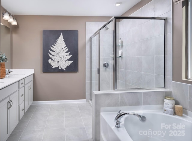 bathroom with plus walk in shower, tile patterned floors, and vanity