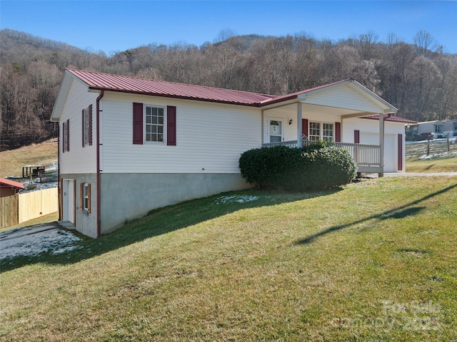 view of front of house featuring a front lawn and a porch