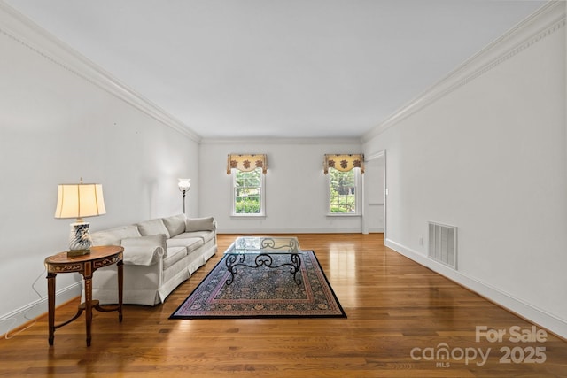 living room featuring ornamental molding and hardwood / wood-style floors