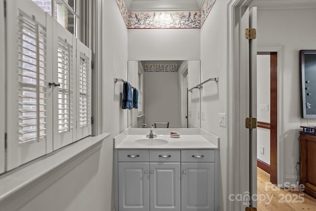 bathroom featuring vanity and crown molding