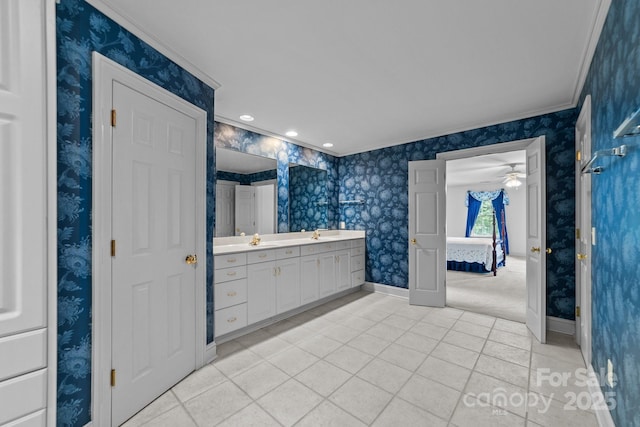 bathroom with crown molding, tile patterned flooring, and vanity