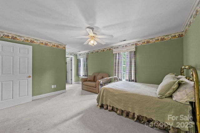 bedroom with ceiling fan, carpet flooring, and ornamental molding