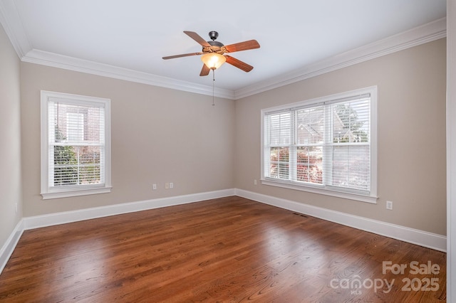 unfurnished room with ornamental molding, dark hardwood / wood-style floors, and a wealth of natural light