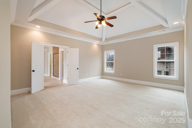 carpeted empty room with ornamental molding, a towering ceiling, and ceiling fan