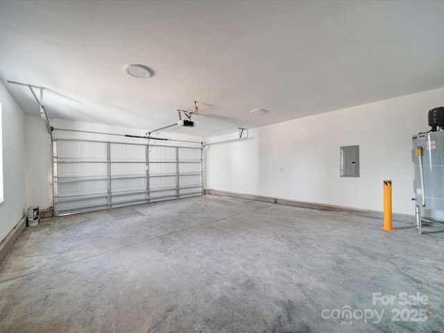 garage featuring electric panel and water heater