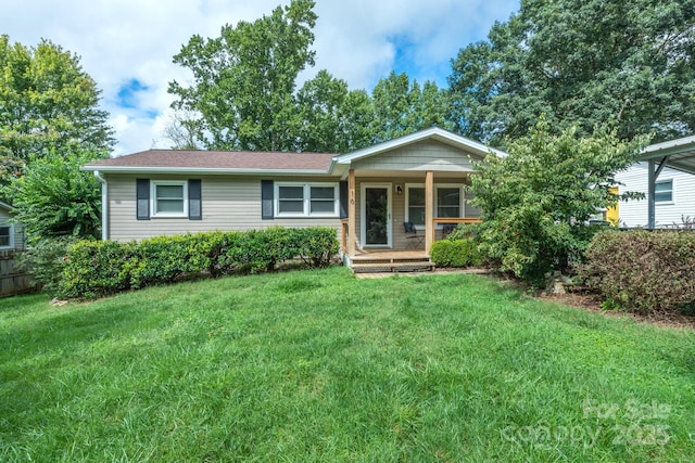 ranch-style house featuring a front yard and a porch