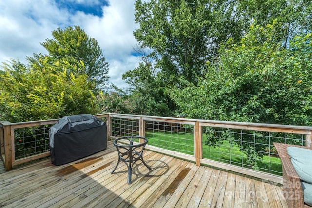 wooden deck featuring grilling area