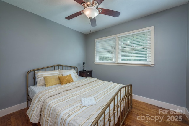 bedroom featuring hardwood / wood-style flooring and ceiling fan