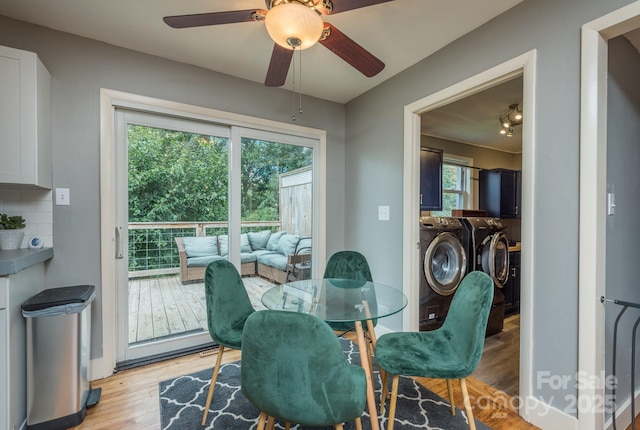 dining area with ceiling fan, independent washer and dryer, and light hardwood / wood-style flooring