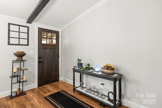 foyer entrance featuring crown molding and light wood-type flooring