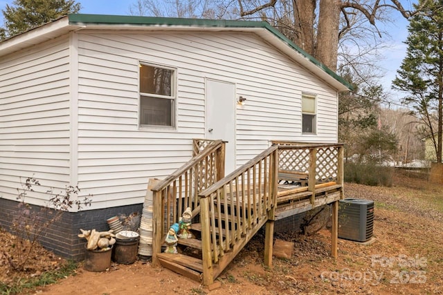 rear view of property with central air condition unit