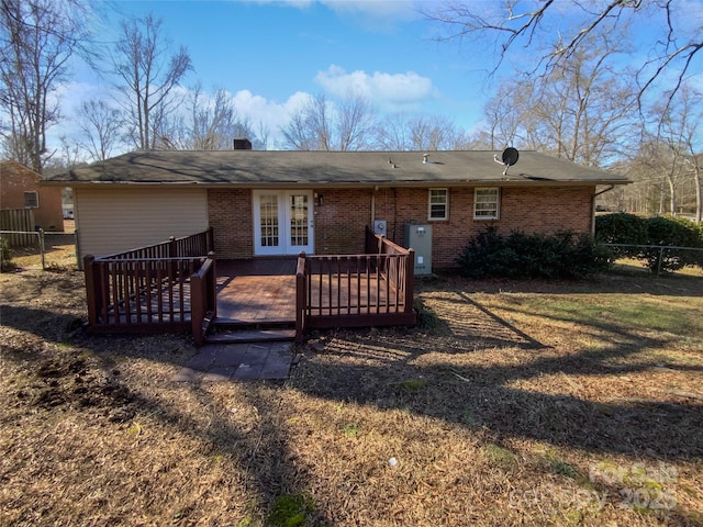 back of property with a wooden deck