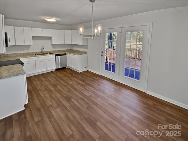 kitchen with dishwasher, white cabinets, sink, decorative light fixtures, and dark hardwood / wood-style floors