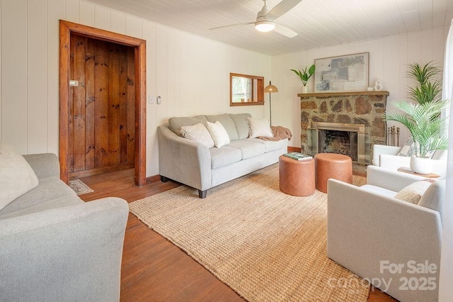 28 Robindale Ave, Asheville, NC 28801 - living room with wood finished floors, a ceiling fan, and a stone fireplace