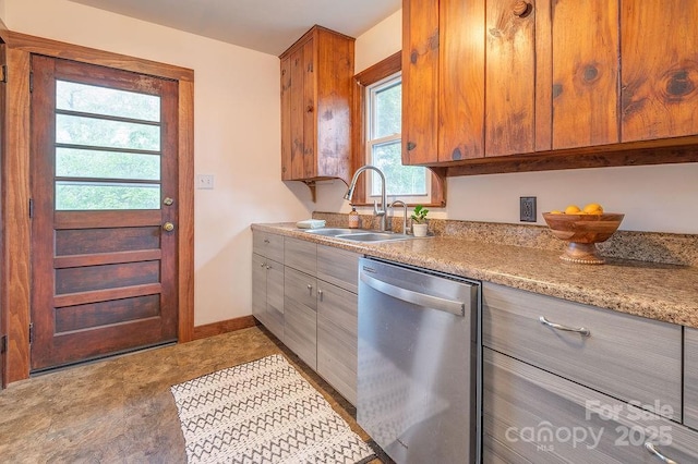 28 Robindale Ave, Asheville, NC 28801 - kitchen featuring stainless steel dishwasher, a sink, light countertops, baseboards, and brown cabinets