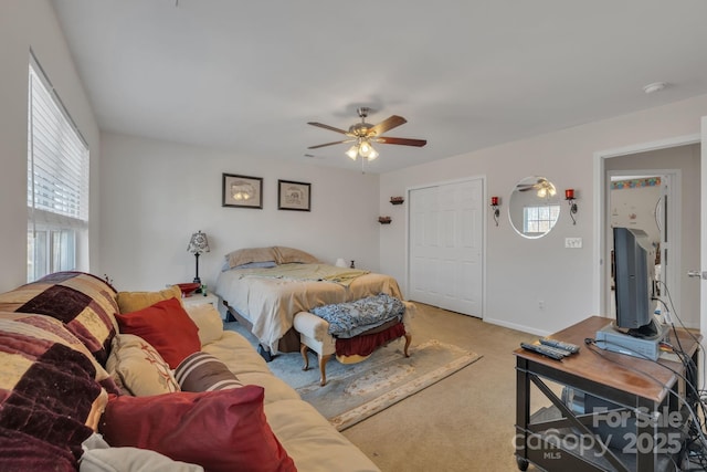 carpeted bedroom with ceiling fan