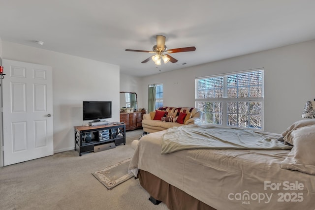 carpeted bedroom featuring ceiling fan