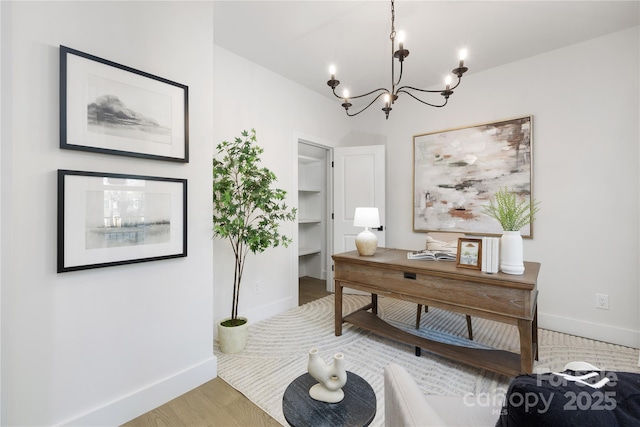 office space featuring a notable chandelier and hardwood / wood-style flooring