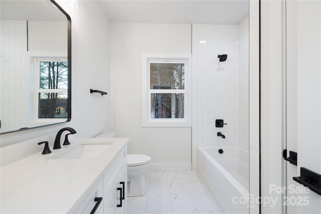 full bathroom featuring toilet, vanity, and tiled shower / bath combo