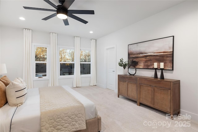 carpeted bedroom with ceiling fan