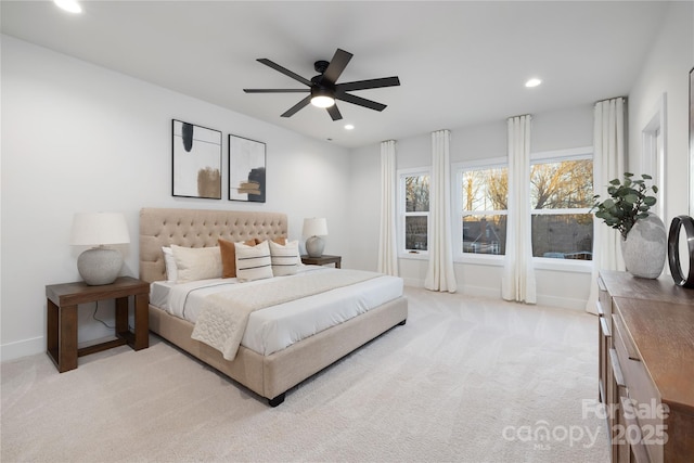 bedroom with ceiling fan and light colored carpet