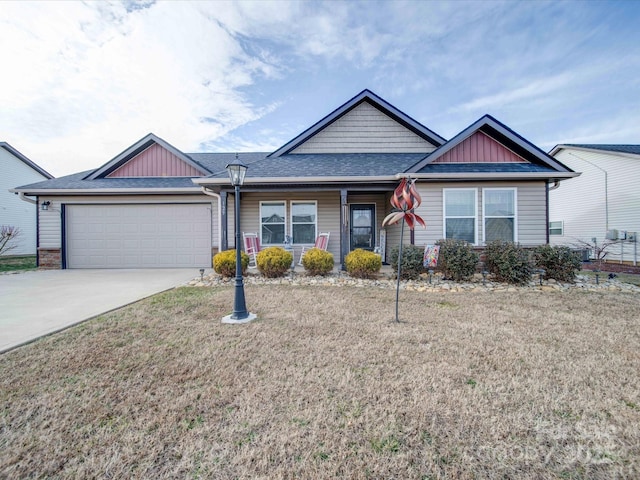 single story home featuring a garage and a front yard