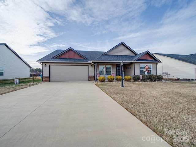 single story home featuring a garage and a front yard