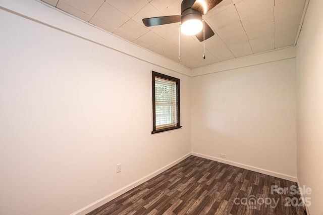 spare room featuring ceiling fan and dark hardwood / wood-style flooring