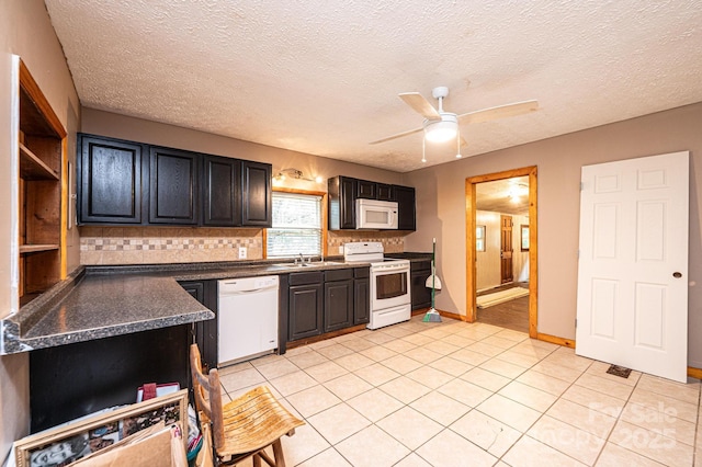 kitchen with a textured ceiling, white appliances, tasteful backsplash, light tile patterned flooring, and ceiling fan