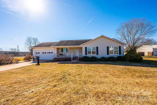 ranch-style home with a garage, covered porch, and a front yard