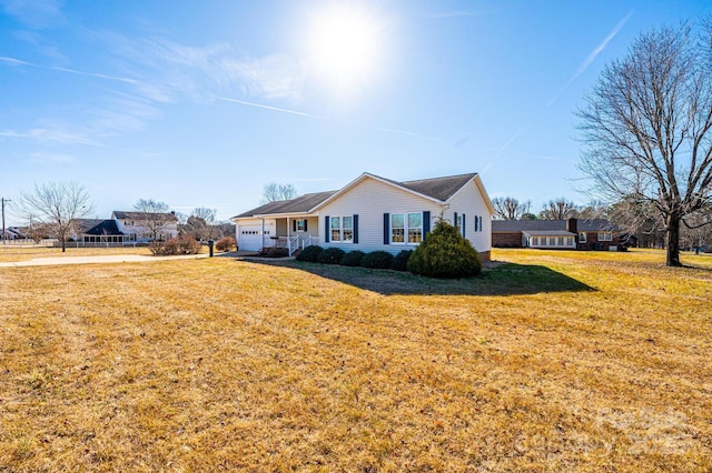 view of front of home featuring a garage and a front yard