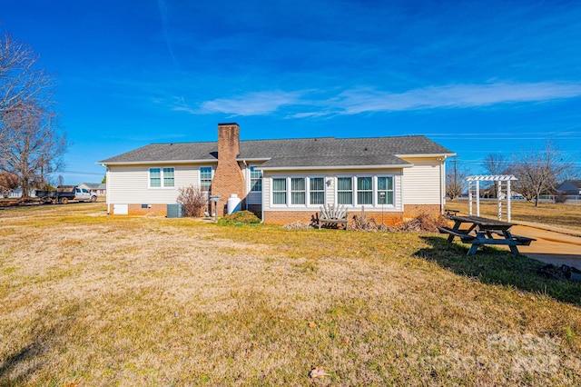 rear view of property with cooling unit, a yard, and a pergola