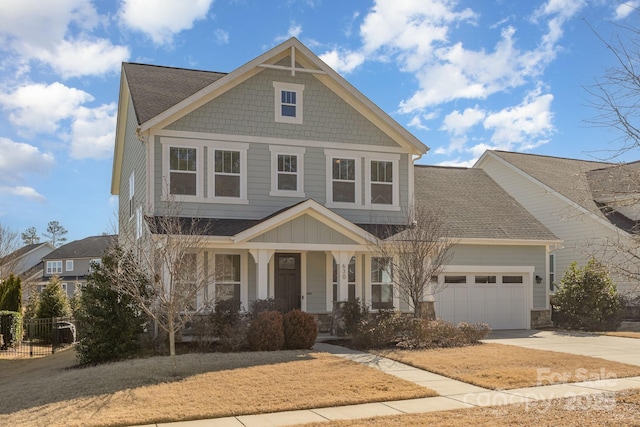 craftsman-style home featuring a porch, concrete driveway, roof with shingles, and an attached garage